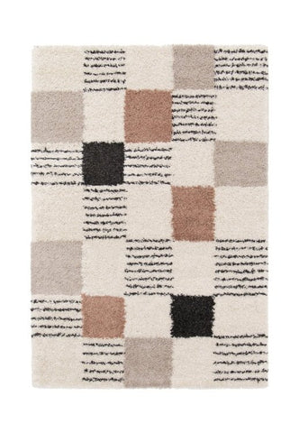 Soft plush rug with textured geometric blocks.