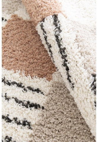 Contemporary block pattern rug with thick pile.