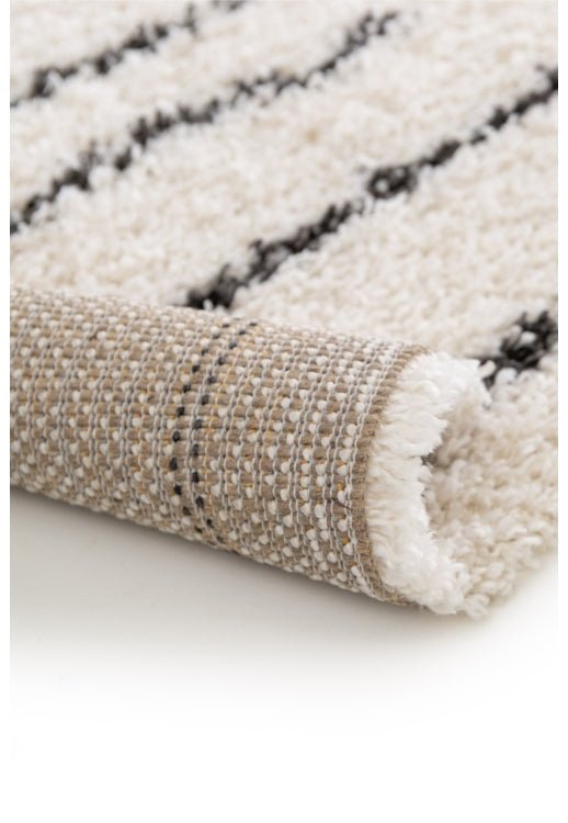 Modern shaggy rug adding texture and depth.