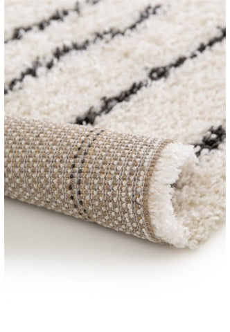 Modern shaggy rug adding texture and depth.