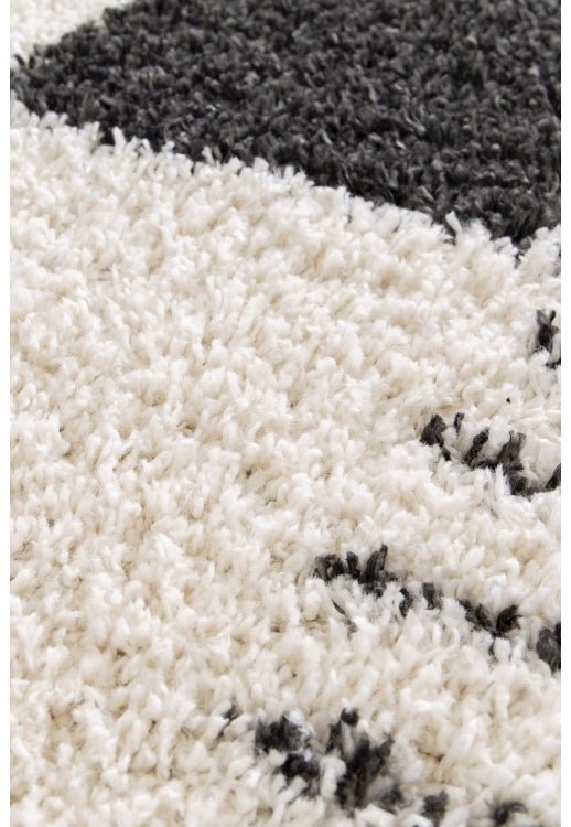 Geometric rug with soft high pile finish.