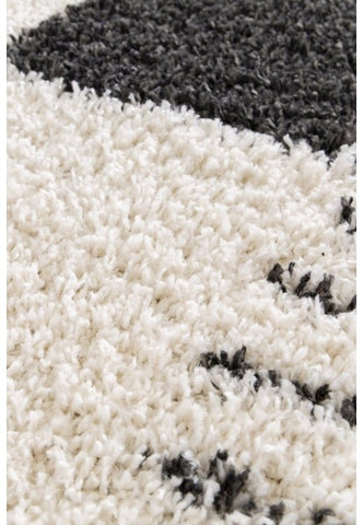 Geometric rug with soft high pile finish.