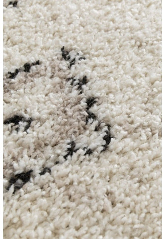 Cozy diamond pattern rug adding warmth to living space.