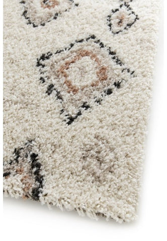 Soft area rug with contemporary diamond pattern.