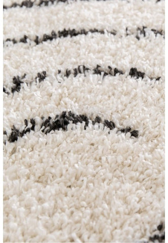 Elegant ivory rug enhancing modern home interiors.
