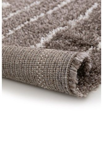 Elegant taupe area rug adding warmth and depth to living space.