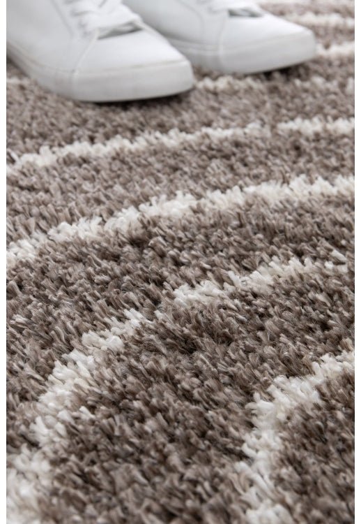 Comfortable taupe rug enhancing contemporary home décor.