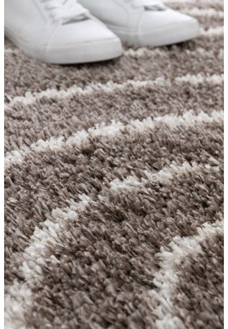 Comfortable taupe rug enhancing contemporary home décor.