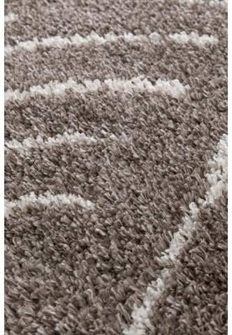 Neutral taupe shade rug adding depth and sophistication.
