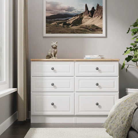 Norfolk White Ash 5 Drawer Chest, Norfolk is a two colour tone Bedroom Furniture which has Bardilon oak top and painted base. Available in choice of 3 colours White, Kashmir and Grey. Fully Assembled. Quick Delivery - Lifestyle Image 