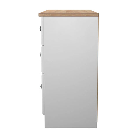 Norfolk White Ash 5 Drawer Chest, Norfolk is a two colour tone Bedroom Furniture which has Bardilon oak top and painted base. Available in choice of 3 colours White, Kashmir and Grey. Fully Assembled. Quick Delivery - Side View