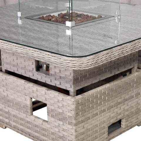 Modern firepit table combining warmth and dining functionality.