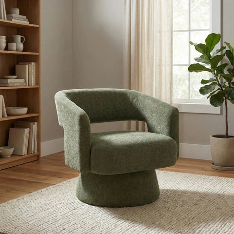 Orla Green swivel accent chair with 360-degree rotation, sculptural design and cut-out back. 