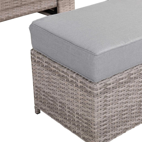 Garden bench providing extra seating for guests.