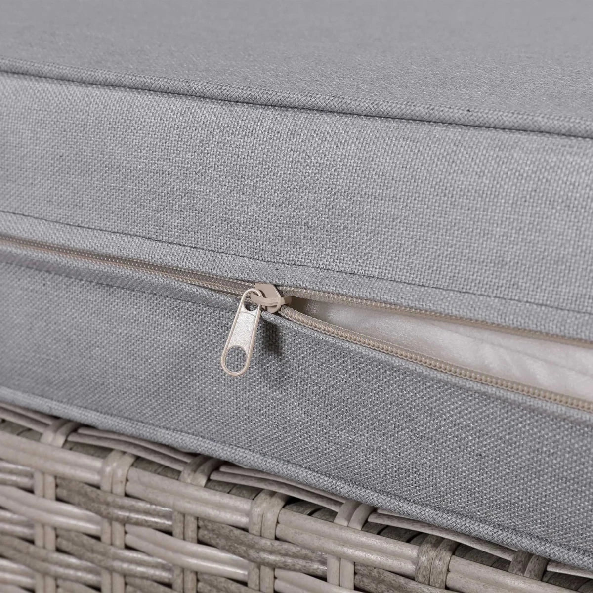 Outdoor cushion with durable zip closure for easy removal.