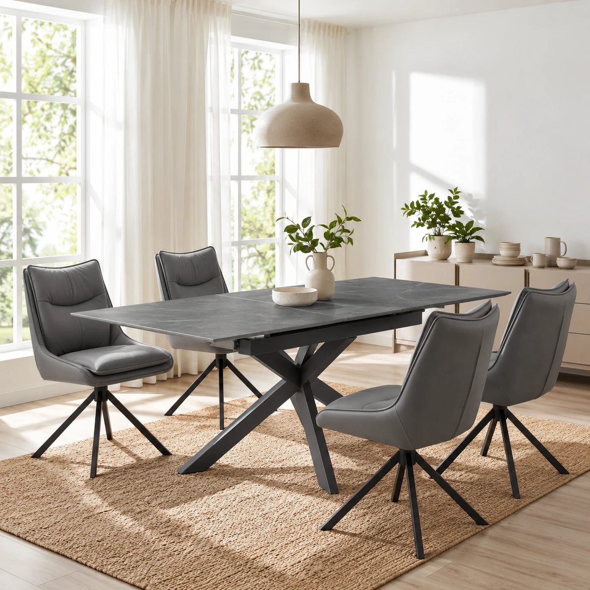 Shop the Oslo Grey ceramic extending dining table with Stone or Grey Vogue leather effect swivel chairs. Extends from 140–180cm for flexible dining.