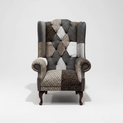 Wiston patchwork Chesterfield wing chair in grey and neutral tones. Handmade in the UK with rolled arms and fixed seat.