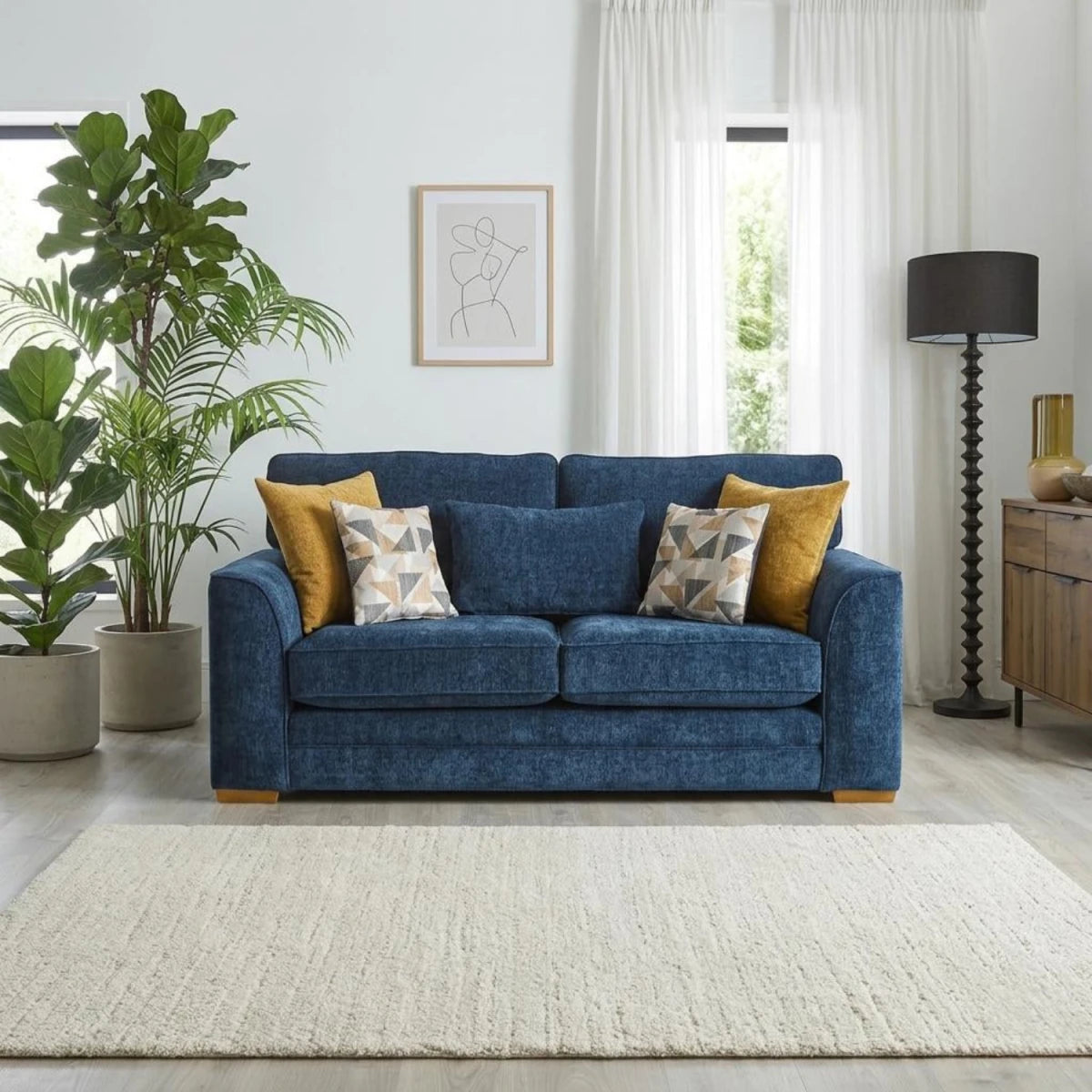 Cozy fabric loveseat with feather-filled cushions.