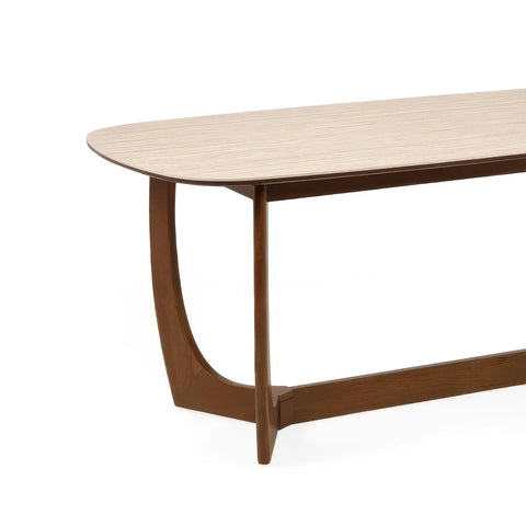 Table Top Close up of Portofino 180cm dining table with a luxurious natural stone top, sculptural walnut-effect base and rounded edges