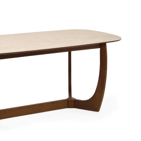 Portofino 180cm dining table with a luxurious natural stone top, sculptural walnut-effect base and rounded edges Table close up
