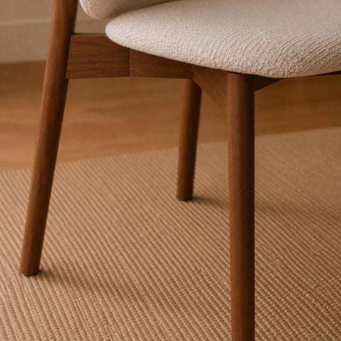 Legs Base Close up of Portofino cream chenille dining chair Featuring padded curved backs, walnut-effect wooden frames and elegant contemporary styling.
