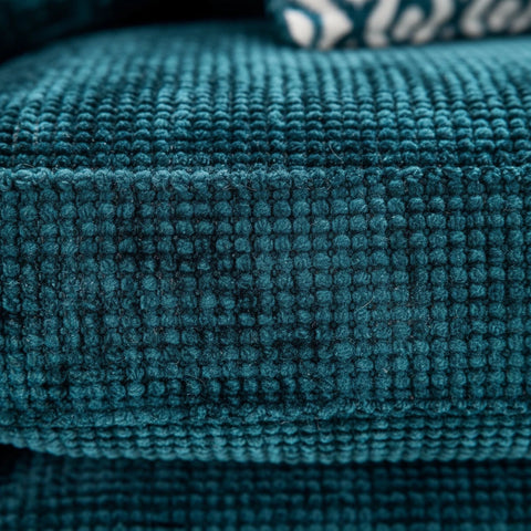 Durable and comfortable fabric upholstery in teal finish.