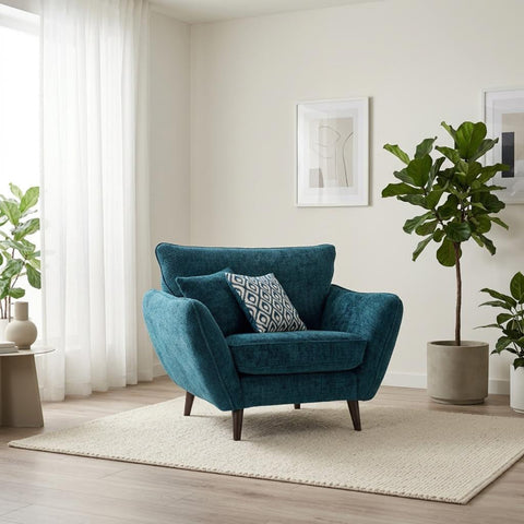 Modern armchair with high back and velvet cushion.