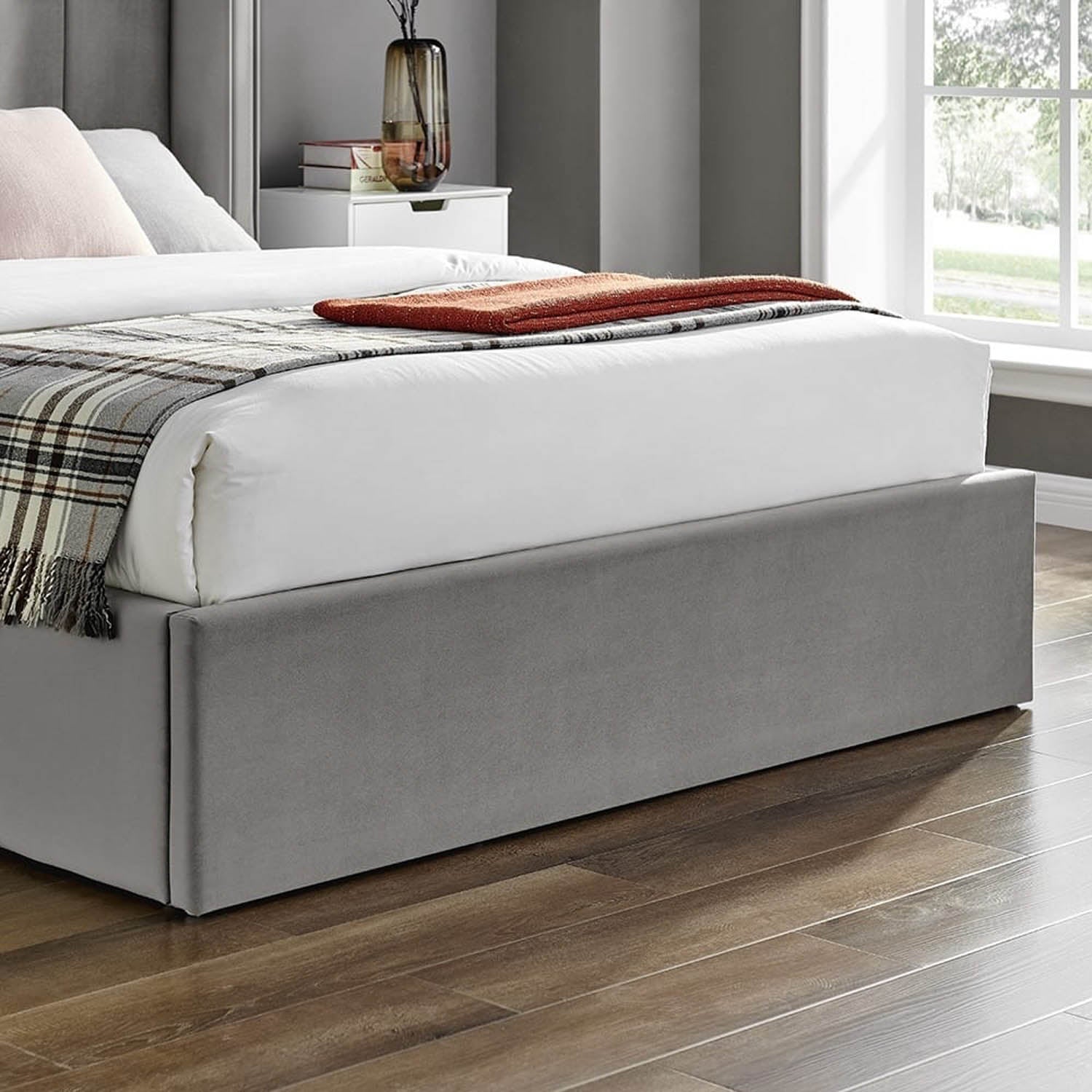 A modern grey upholstered bed frame with a platform base. Polara Elite Storage Bed available in Silver, Natural or Navy. Available in Double or Kingsize.
