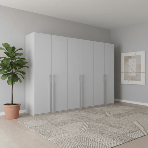Modern room with a large Kacey Pure 6 Door wardrobe, potted plant, and abstract art on the wall.