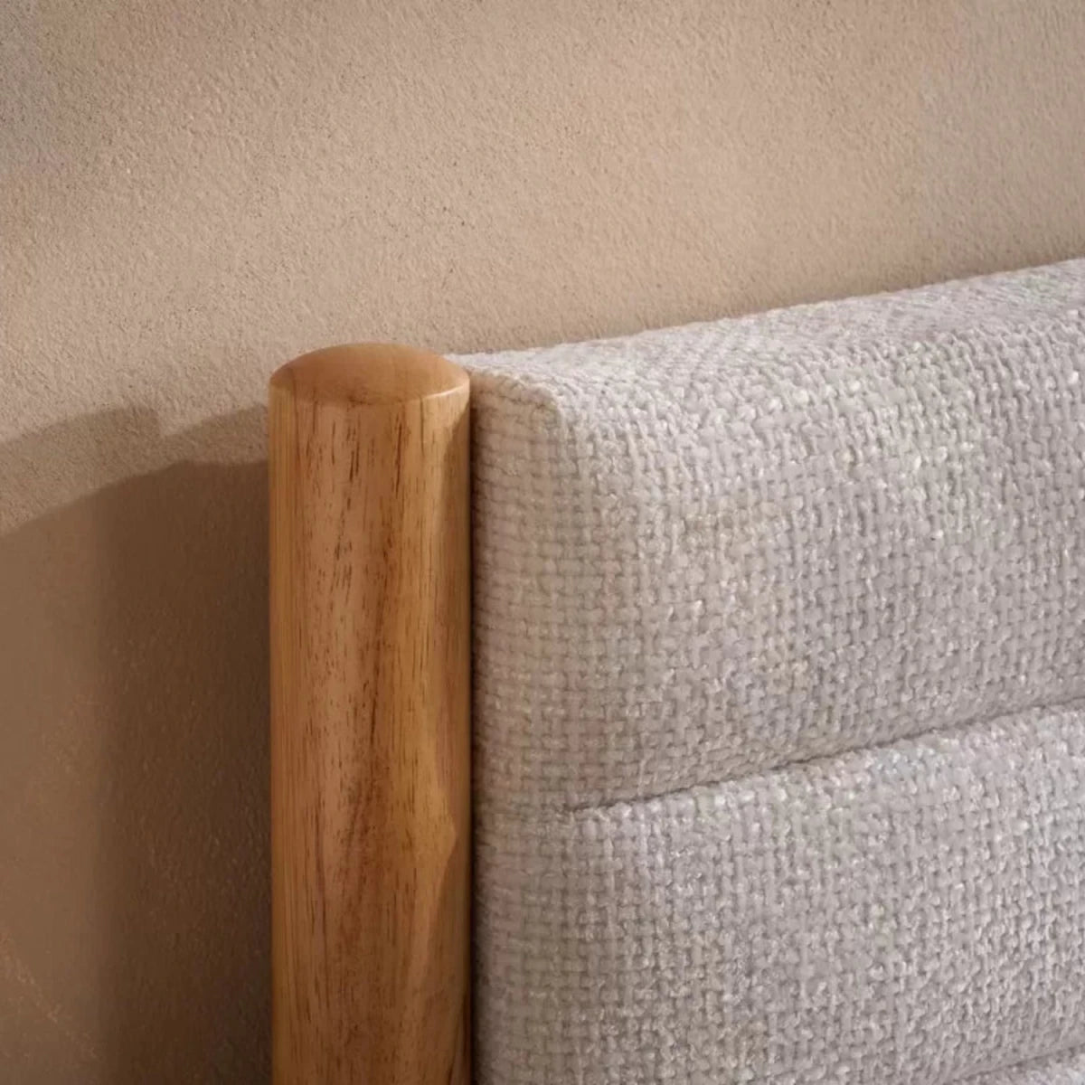 Grey velvet headboard with deep tufting and luxurious finish.