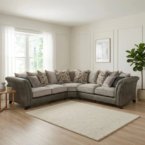 Large L-shaped Regent sofa with fibre cushions and hardwood frame.