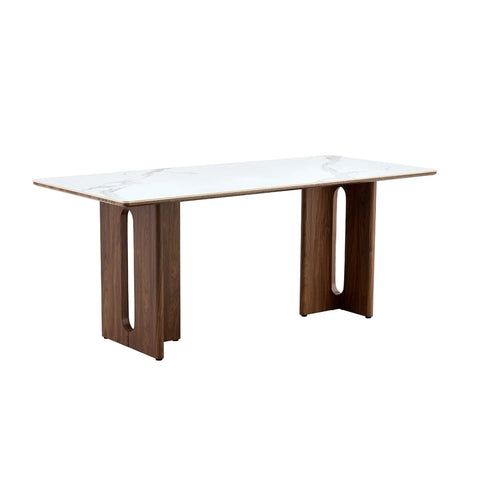 Dining table with white marble top and wooden legs on a white background