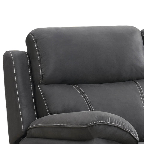 Close-up of a dark gray upholstered recliner chair showing the backrest, armrest, and white contrast stitching against a white background.