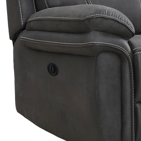 Close-up of a dark gray upholstered recliner chair showing the side armrest, padded backrest, white contrast stitching, and a circular power control button.