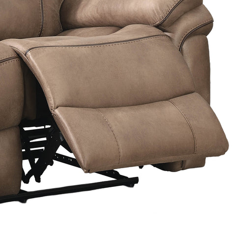 Close-up of a reclining upholstered chair in a warm taupe-brown color, showing the extended footrest and black metal support frame against a white background.