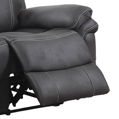 Close-up of a dark gray recliner chair with white contrast stitching, showing the padded backrest and extended footrest against a white background.