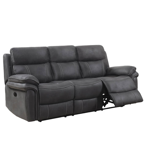 A dark gray three-seat reclining power sofa with a partially extended right footrest, shown against a plain white background.