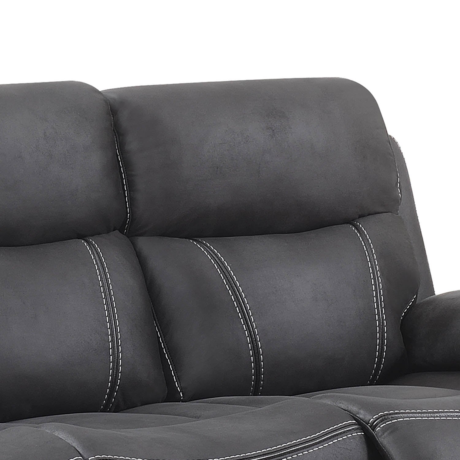 Close-up of a dark gray faux leather reclining sofa with white contrast stitching, showing the back cushions and part of the seat against a white background.