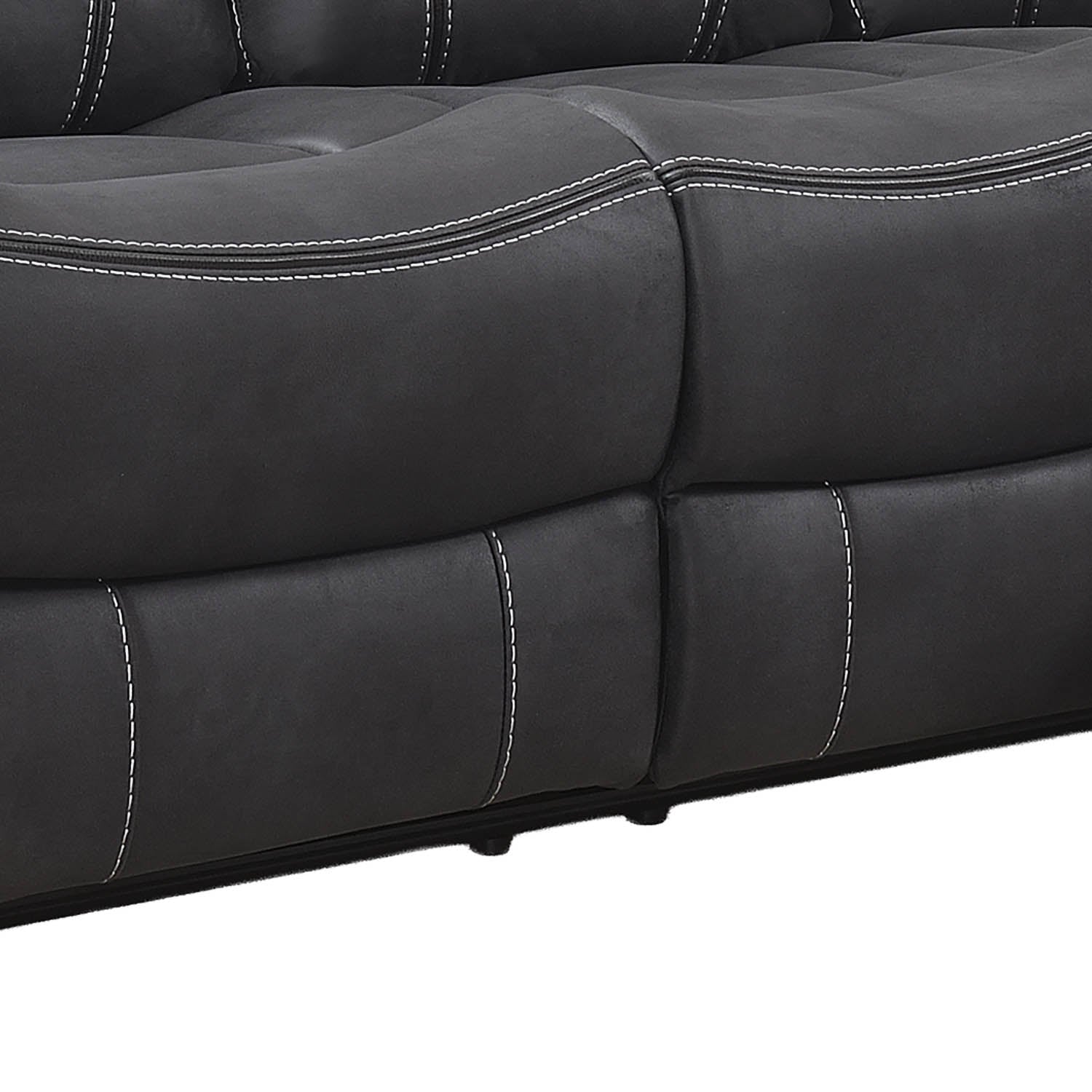 Close-up of a dark gray tufted leather or faux leather sofa section with white contrast stitching, showing the seat and back cushions against a white background.