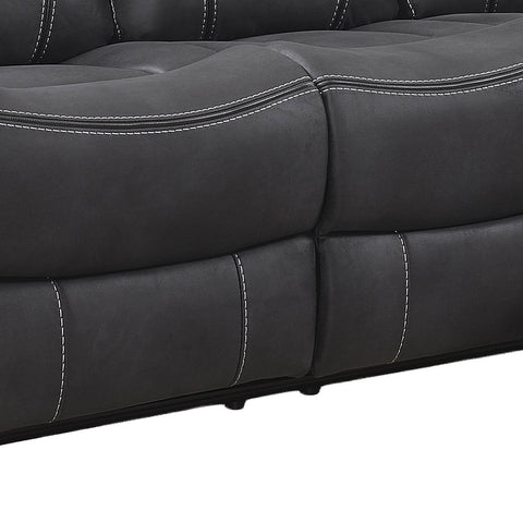 Close-up of a dark gray tufted leather or faux leather sofa section with white contrast stitching, showing the seat and back cushions against a white background.