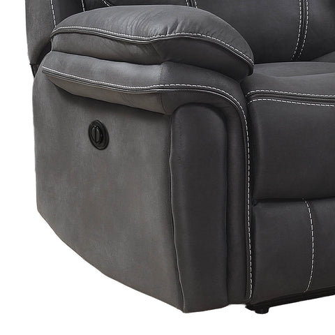 Close-up of a dark gray upholstered recliner chair showing the side bolster, padded armrest, white contrast stitching, and a black power control button on a white background.