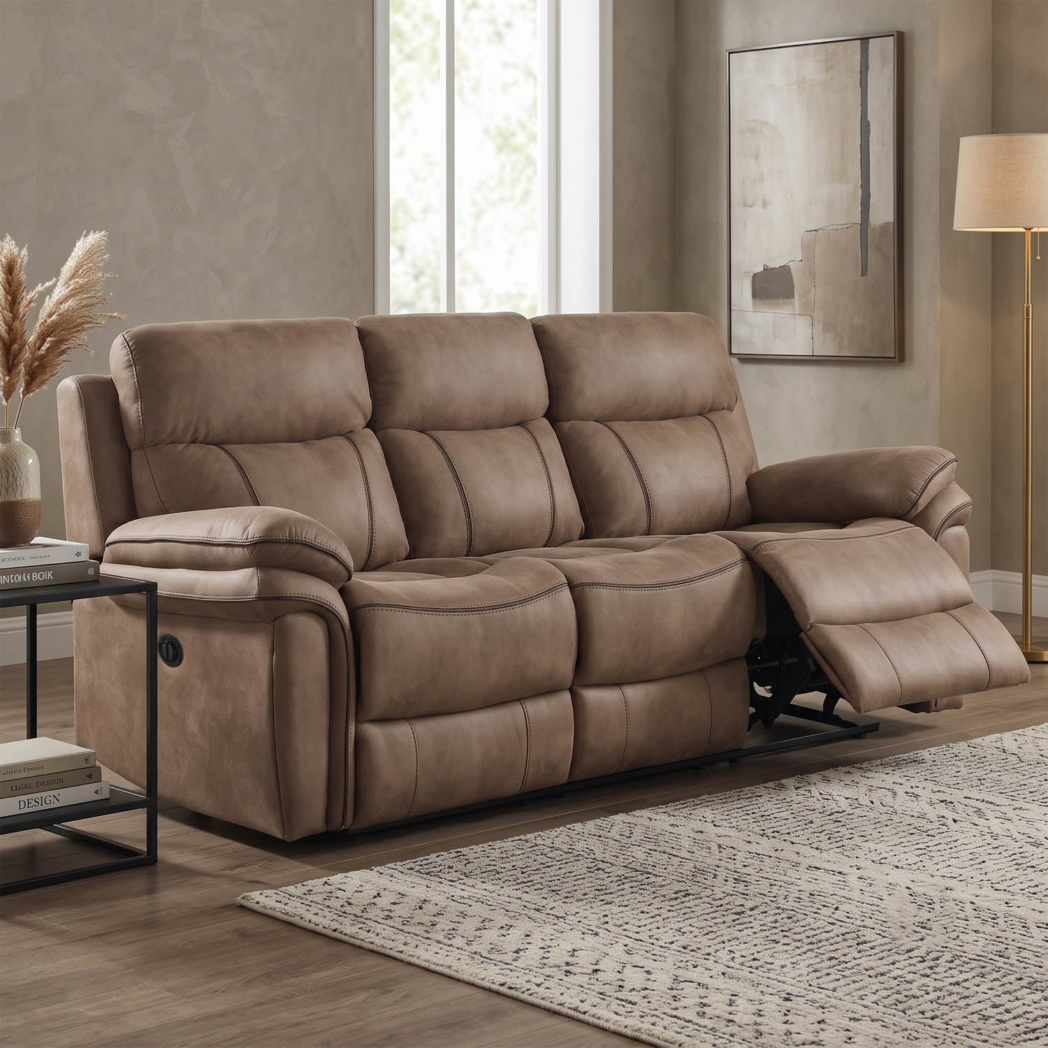A three-seat reclining loveseat in taupe brown faux leather, shown with the right footrest extended in a modern living room setting.