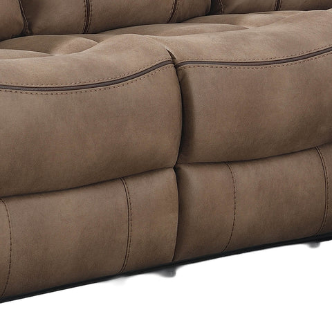 Close-up of a brown tufted upholstered sofa cushion with visible stitching and dark piping, shown against a white background.