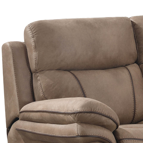 Close-up of a taupe brown upholstered recliner chair showing the backrest, armrest, and decorative contrast stitching against a white background.