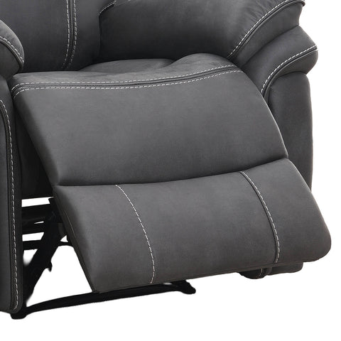 Close-up of a dark gray recliner chair with white contrast stitching, showing the extended footrest and padded armrests against a white background.