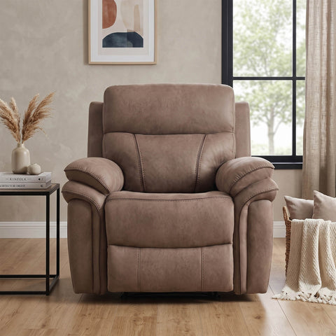 A Fabric upholstered recliner chair in a warm taupe-brown sahara  color, positioned in a styled living room setting with a side table, window, and neutral decor.