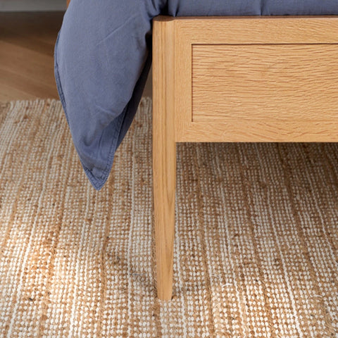 Solid wooden bed legs providing strong support and stabilit.