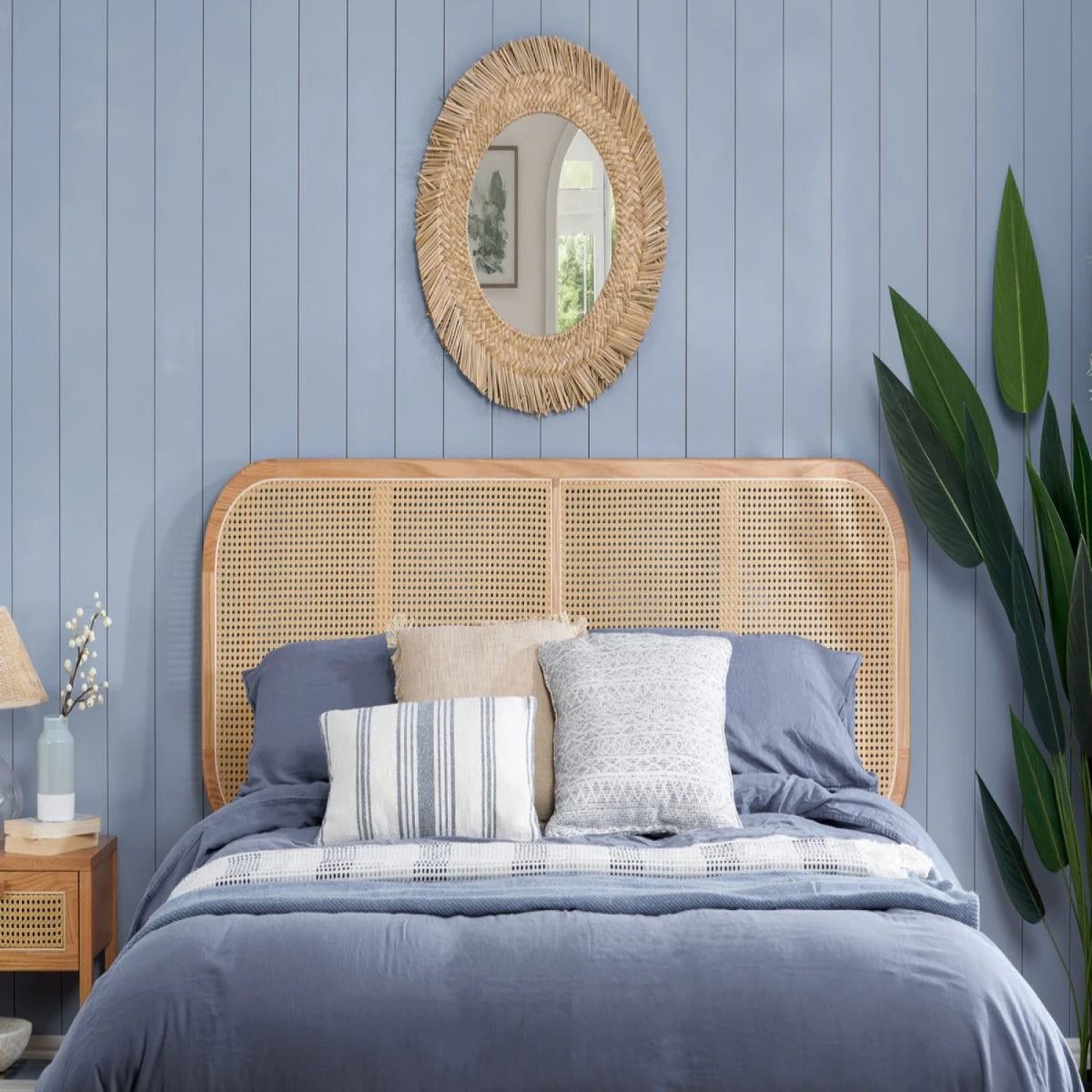 Cane headboard with handcrafted rattan weave and organic finish.