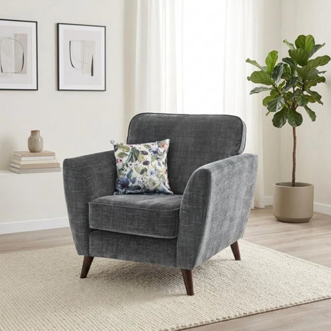 Modern velvet chair with supportive seating and wooden legs.
