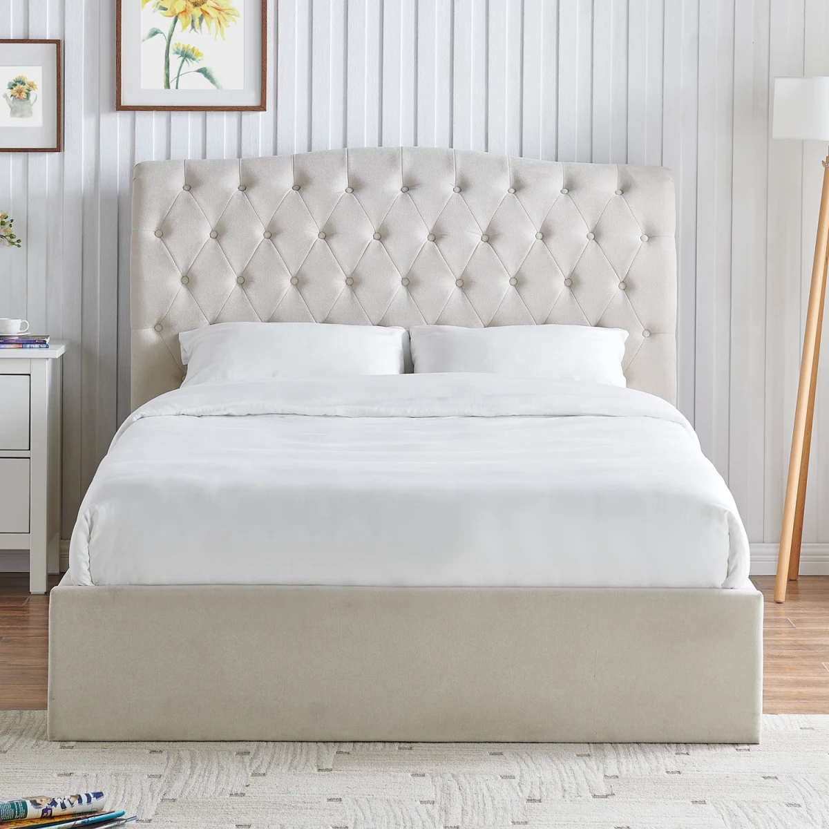 Rosina Ottoman Storage Luxe Bed. A beige upholstered storage bed with a tufted headboard and natural beige fabric base